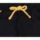 Czarne dresowe spodnie chłopięce z żółtym ozdobnym lampasem BATMAN